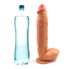 12 inch dildo standing upright next to a water bottle for scale