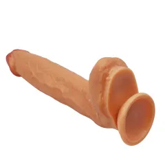 Underside of the dildo showing the wide 3 inch suction cup base and testicles