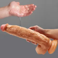 Realistic dildo held under running water to show the silicone surface rinses clean