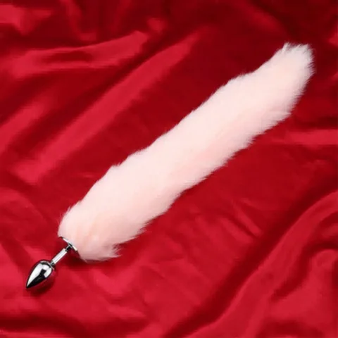 Close-up of the soft fluffy pink faux fur tail attached to the anal plug
