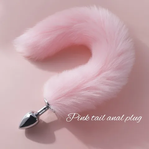 Pink tail anal plug with a long fluffy faux fur tail shown against a clean background