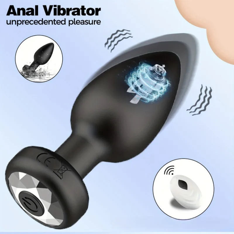 Black silicone vibrating anal plug with a faceted base and the white handheld remote that controls it
