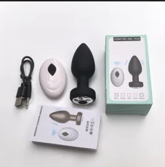 Kit laid out beside its colour box showing the charging cable white remote black plug and user manual