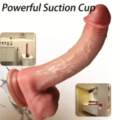 Dildo standing upright on a smooth surface via its suction cup base