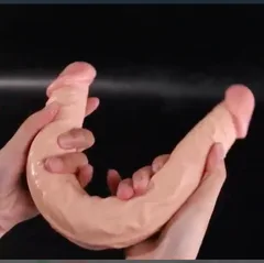 Silicone double dildo folded back on itself to show the flexible bendable shaft