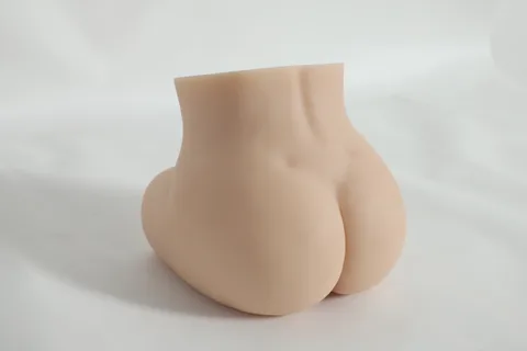 Three-quarter rear angle of the super realistic sex doll highlighting waist and hip curves