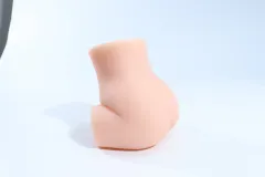 Side profile of the torso butt masturbator showing its curved body contour