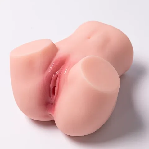 Realistic butt doll masturbator in soft TPE with dual vaginal and anal openings shown at an angle