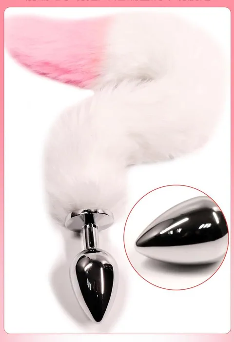 Pink and white fox tail anal plug with a polished metal plug and a curled faux fur tail