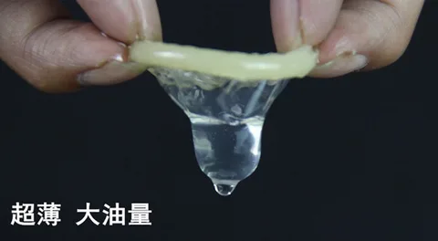 Ultra-thin latex condom detail showing the rolled rim and clear film
