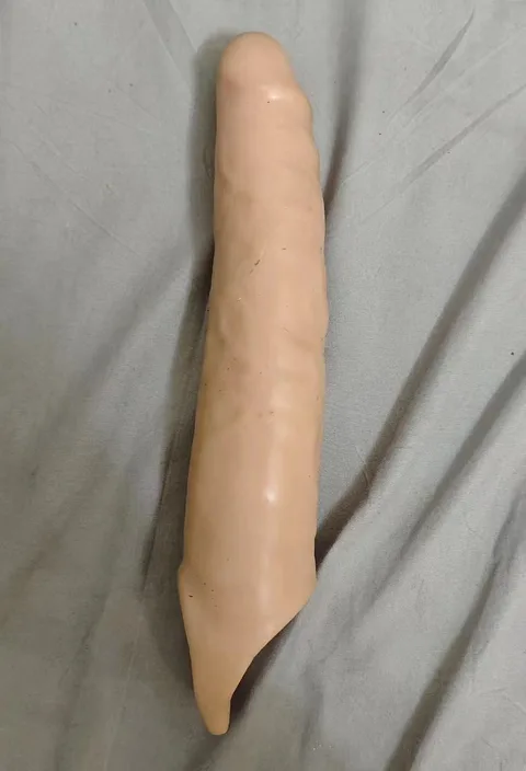 Flesh-coloured large spiked penis sleeve with textured shaft and tapered base