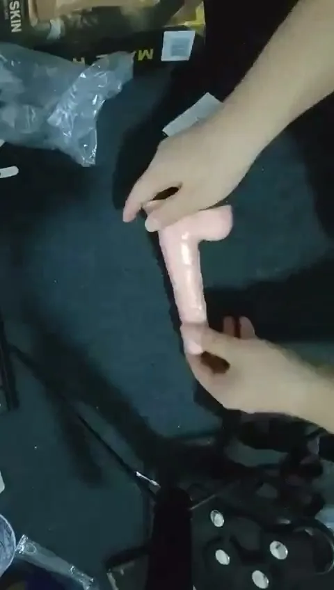 Realistic silicone strap-on dildo shown upright showing full shaft length