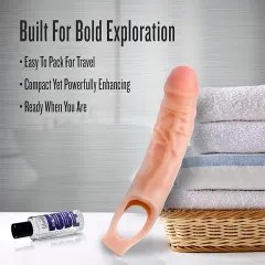 Close-up of the penis extender sleeve showing its realistic skin-like texture and head shape