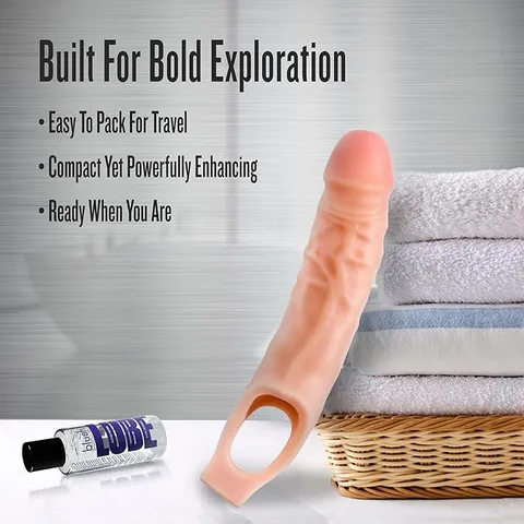 Close-up of the penis extender sleeve showing its realistic skin-like texture and head shape