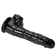 Black realistic dildo kept upright by suction cup base