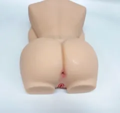 Close-up of the VIP48 torso doll showing the skin-textured TPE surface and moulded body detail