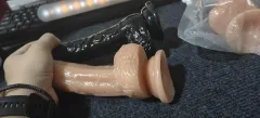 Realistic glans and testicle detailing on the flesh coloured silicone dildo