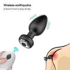 Detail shot of the black vibrating anal plug with its button-battery remote