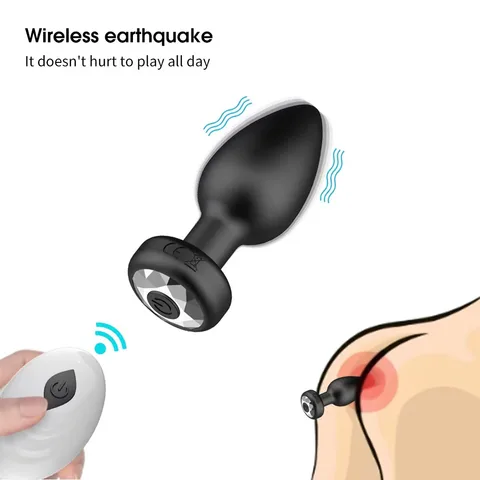 Detail shot of the black vibrating anal plug with its button-battery remote
