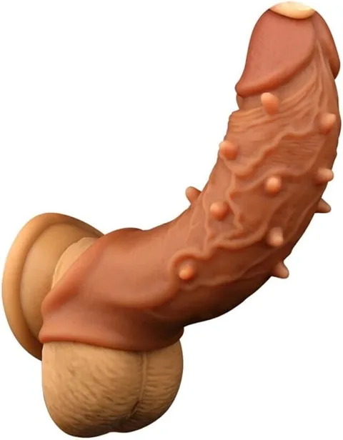 Flesh-toned realistic spiked penis sleeve with studded particle surface and sculpted glans