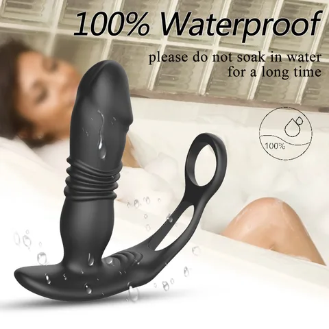 Dual-ring base of the black anal vibrator on a plain background
