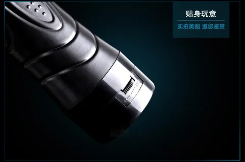 Close-up of the black vibrating masturbator cup entry opening and inner texture