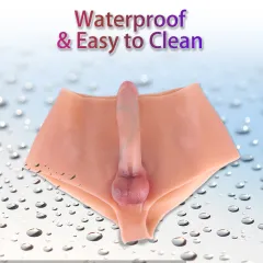 Waterproof wearable dildo pants resting on a wet surface to show the rinse-clean silicone