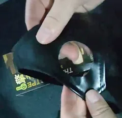 Black fabric dildo harness with the elastic O-ring opening used to mount the dildo